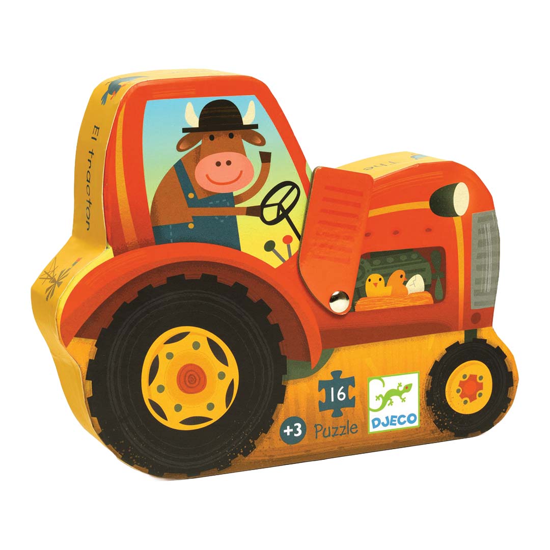 Djeco kartonnen puzzelverpakking in de vorm van een oranje tractor met een koe achter het stuur.