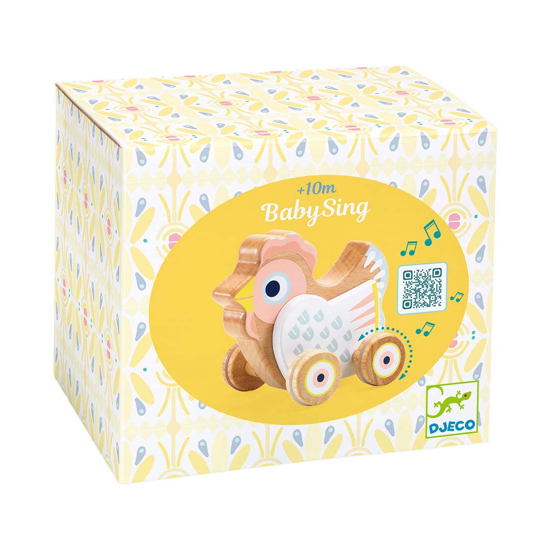 De verpakking van het Djeco Baby Sing houten rijdend muziekfiguur met een gele achtergrond en bloemenpatroon.