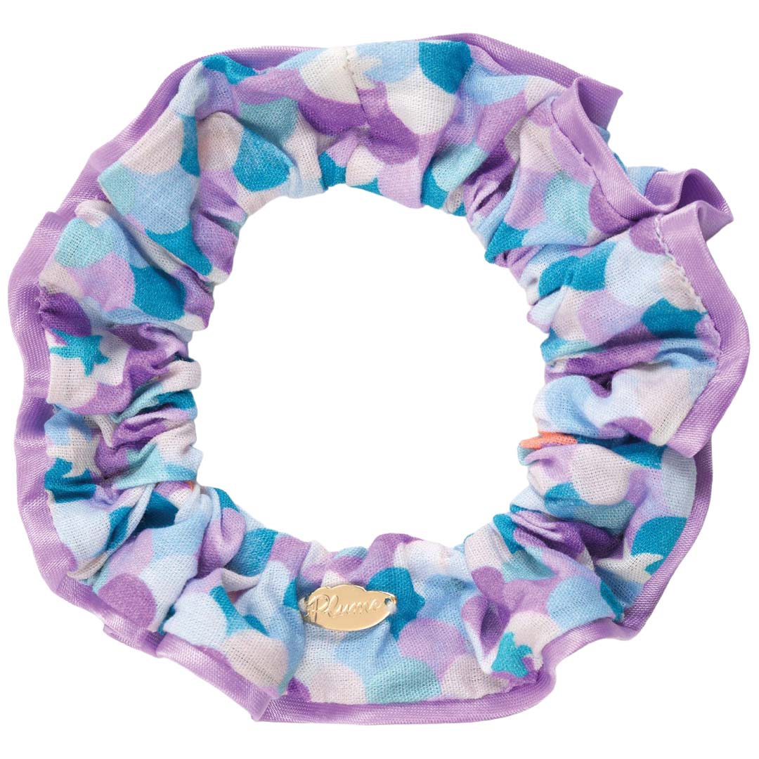 Djeco haarelastiek met paars en blauw puntenpatroon.