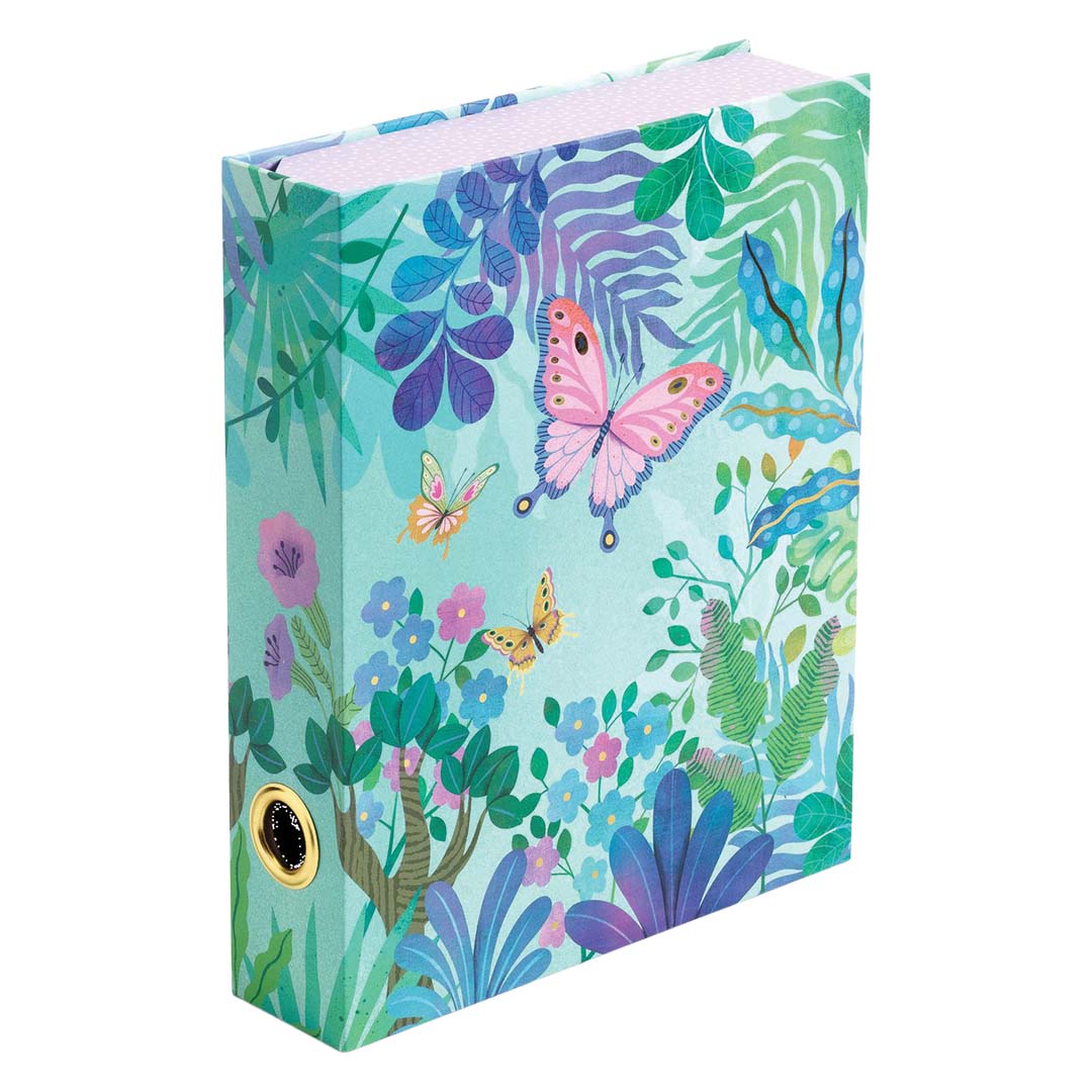 Gesloten stationary box in de vorm van een boek, versierd met een tropische tuinafbeelding en vlinders.