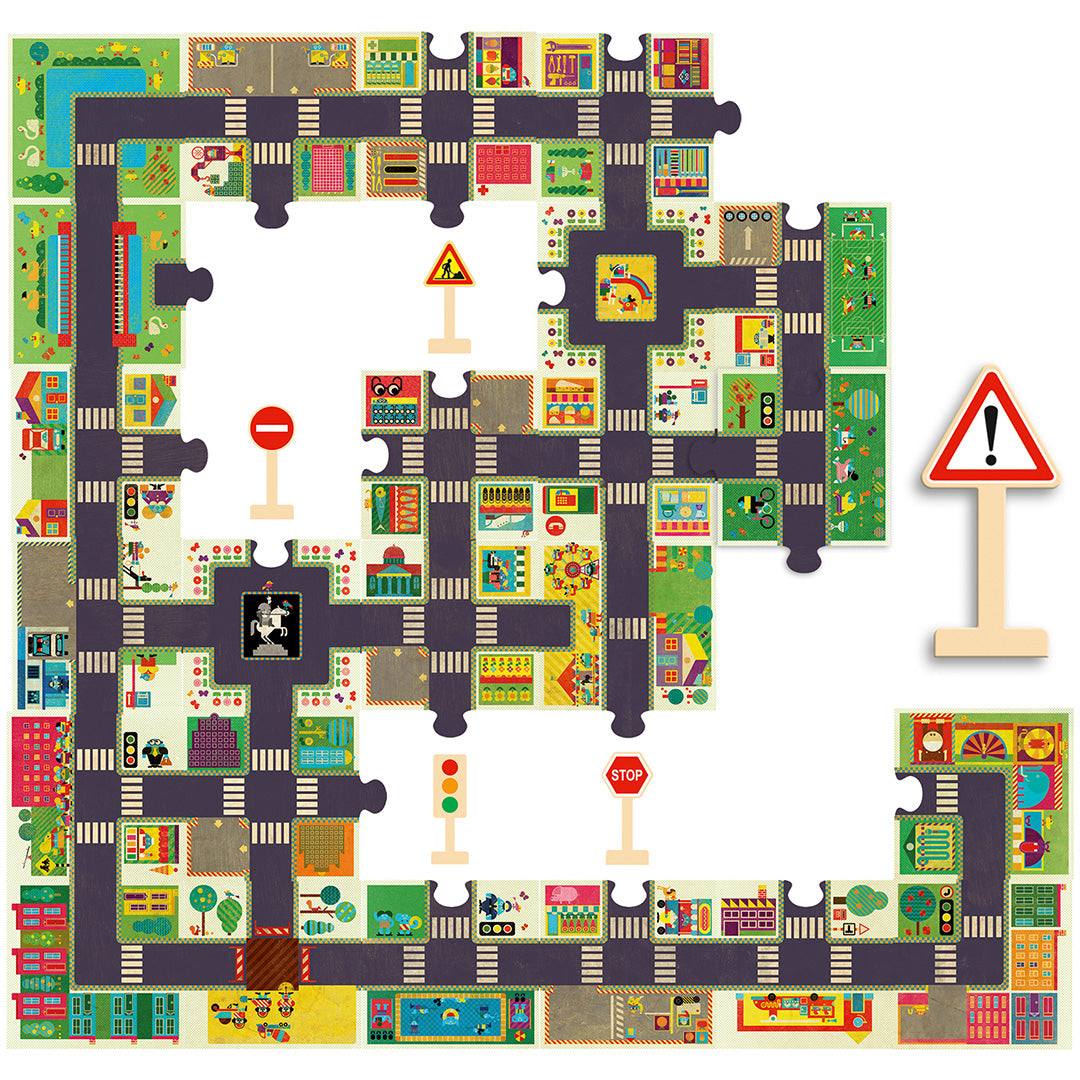 Djeco vloerpuzzel 'De Grote Stad' met deels gelegde puzzelstukken die een stad met wegen en gebouwen vormen, inclusief houten verkeersborden.