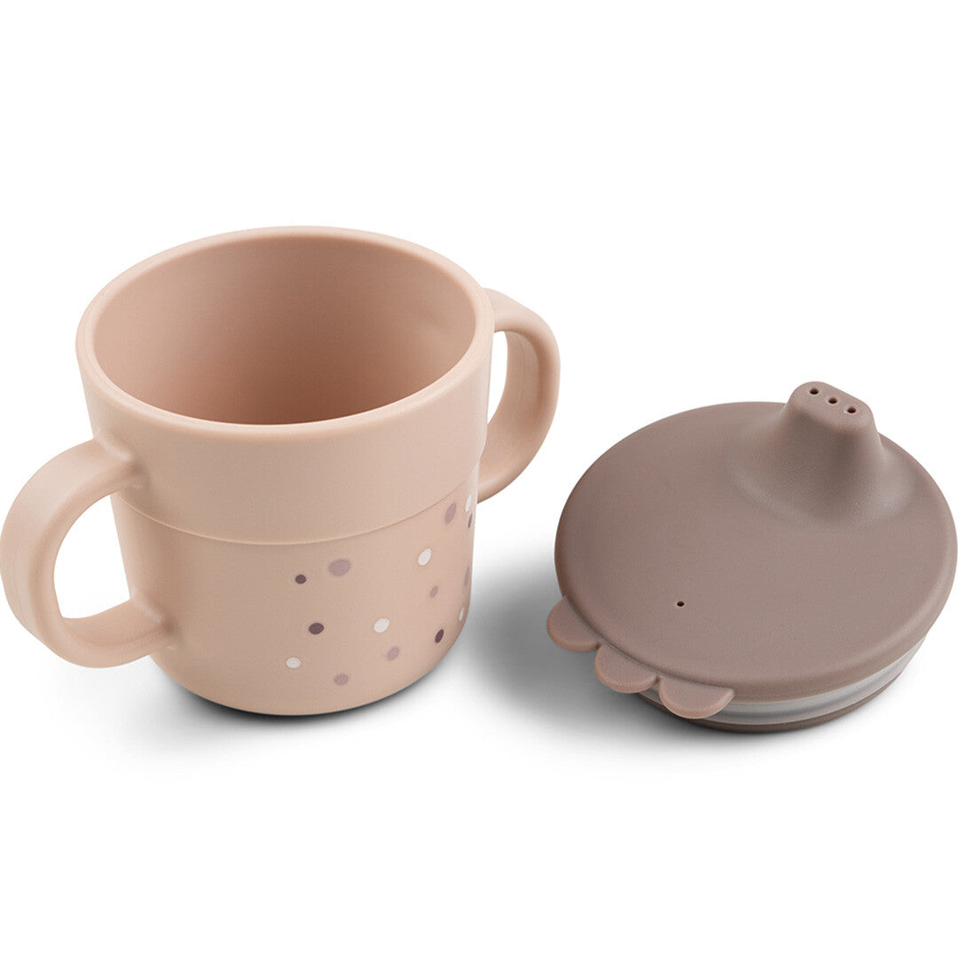 Done by deer roze tuitbeker met happy dots patroon en losse bruine deksel ernaast.