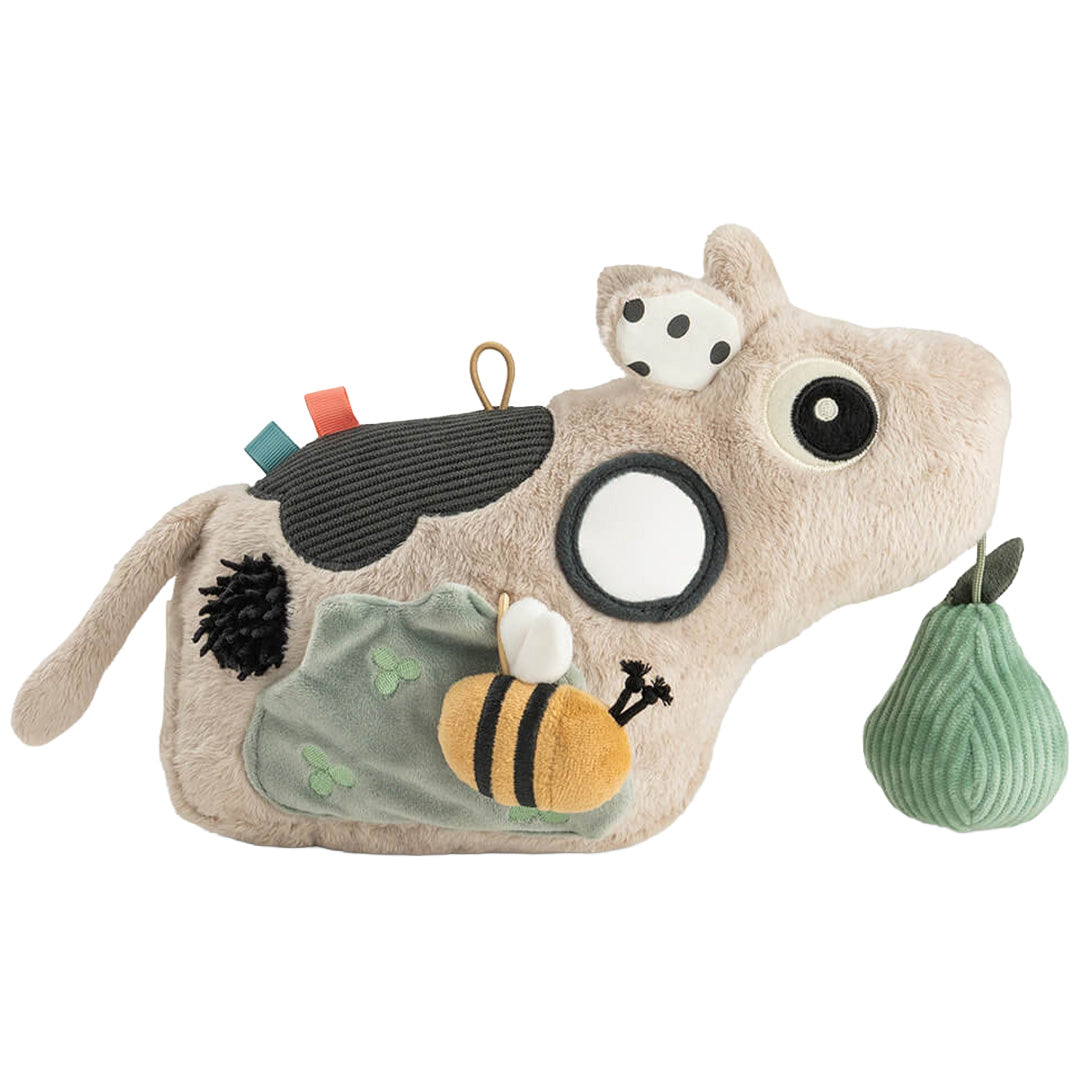 Done by deer activiteitenspeelgoed in de vorm van een beige koe met een bijtje en een groene peer.