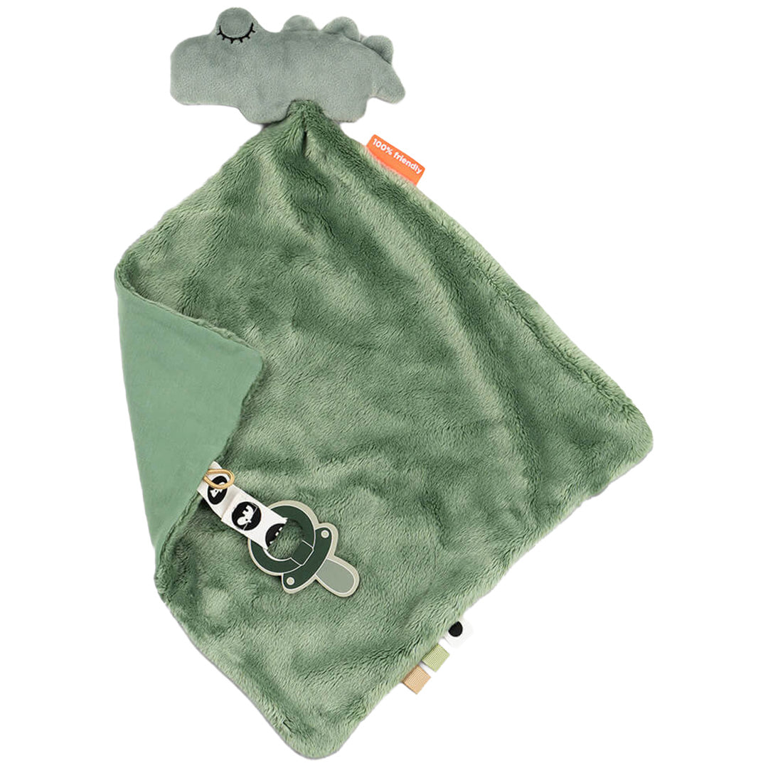 Done by Deer groene babyspeendoek met krokodillenhoofd en speenclip, schuin gefotografeerd.