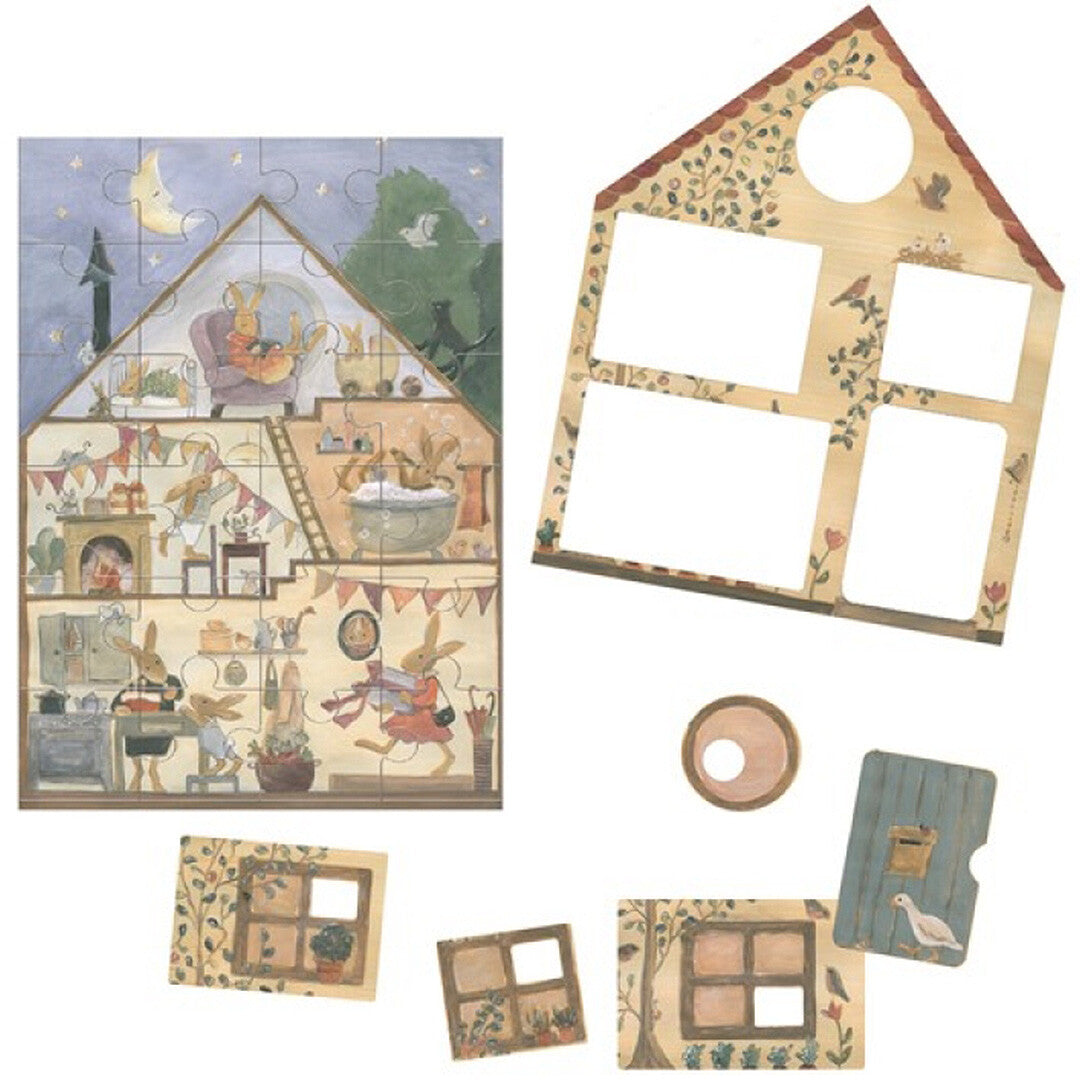 Egmont Toys puzzel van een konijnenhuis, deels in elkaar gezet met de binnenkant van het huis en losse stukken van de buitenkant.