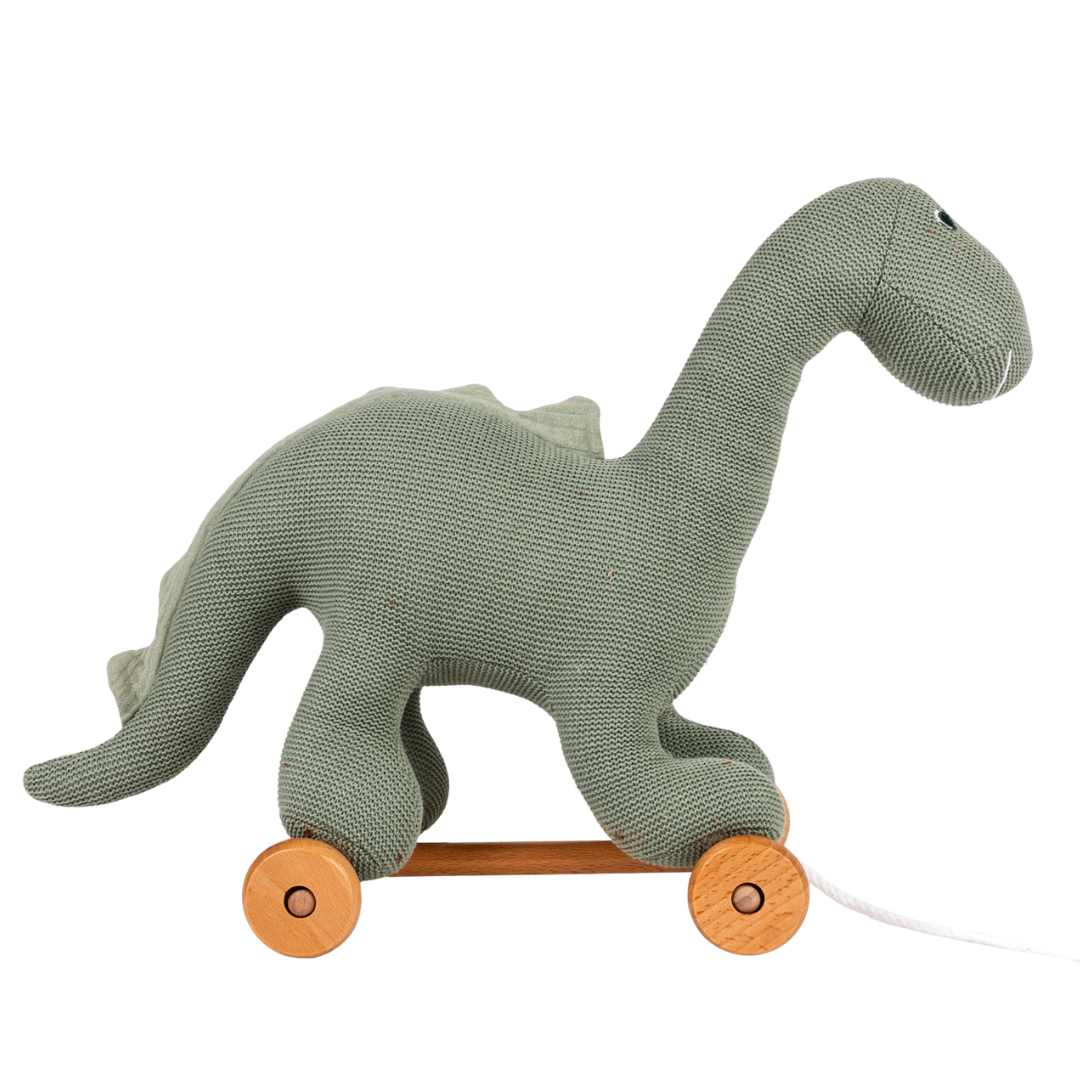 Egmont Toys groene gebreide dinosaurus Victor trekfiguur, van de zijkant gezien.