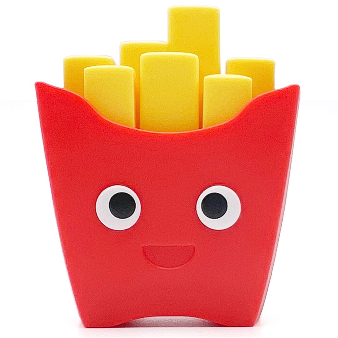 fidget go friemelspeelgoed in de vorm van een rood frietbakje met gele frietjes en een lachend gezicht.