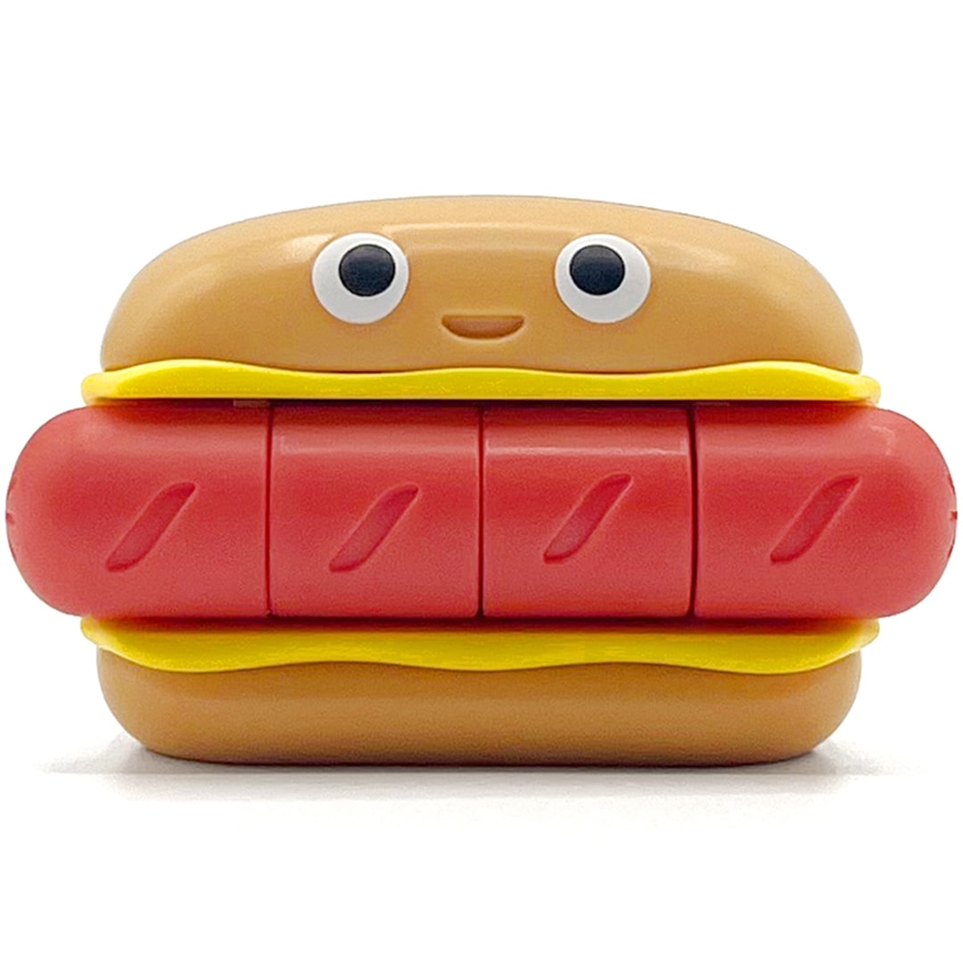 Fidget go friemelspeelgoed in de vorm van een hotdog met een vrolijk gezichtje, van voren gezien.