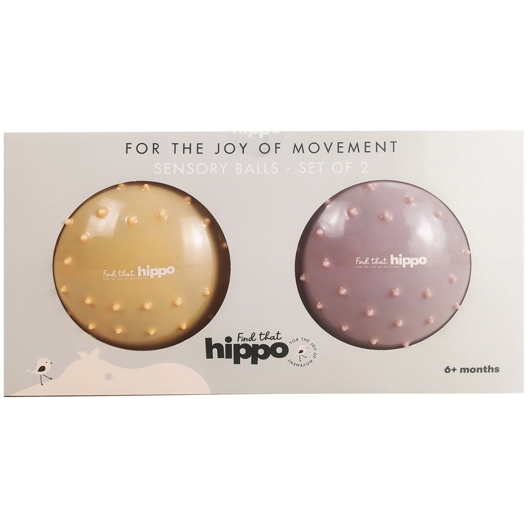 De verpakking van de find that hippo set met twee sensorische ballen, één geel en één roze.