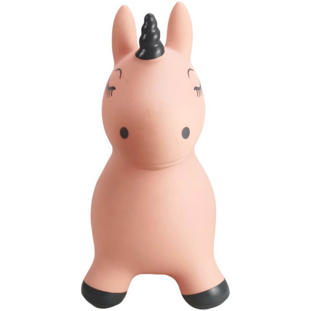Vooraanzicht van het find that hippo roze opblaasbare eenhoorn skippydier met gesloten ogen en zwarte hoorn.