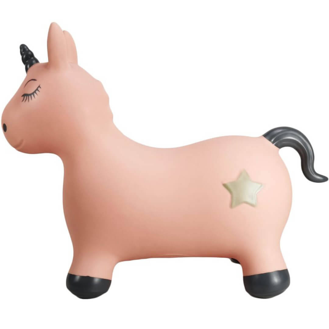 Zijaanzicht van het find that hippo roze opblaasbare eenhoorn skippydier met een ster op de flank.