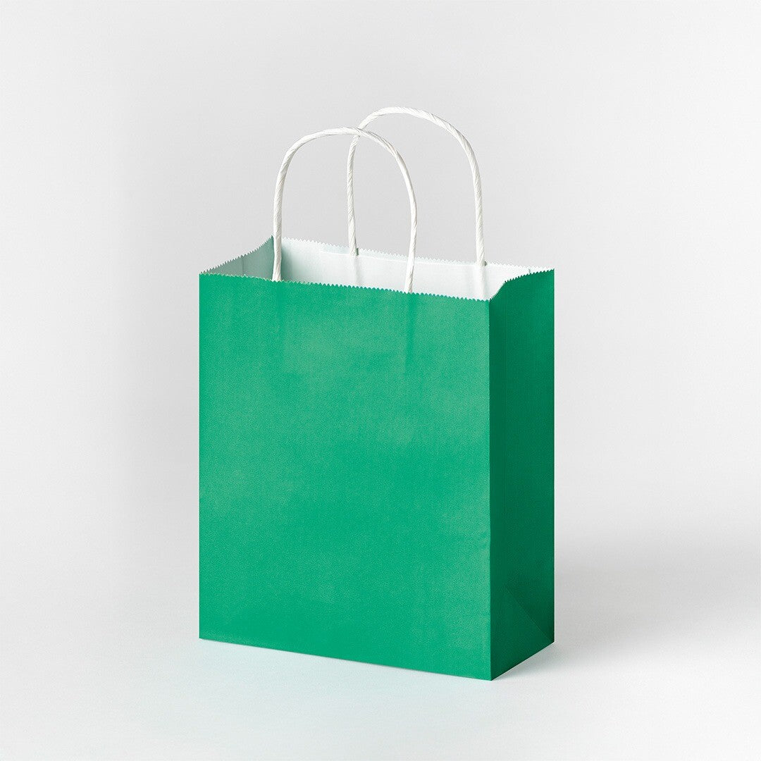 Een groen Folia papieren cadeauzakje met witte handvatten.