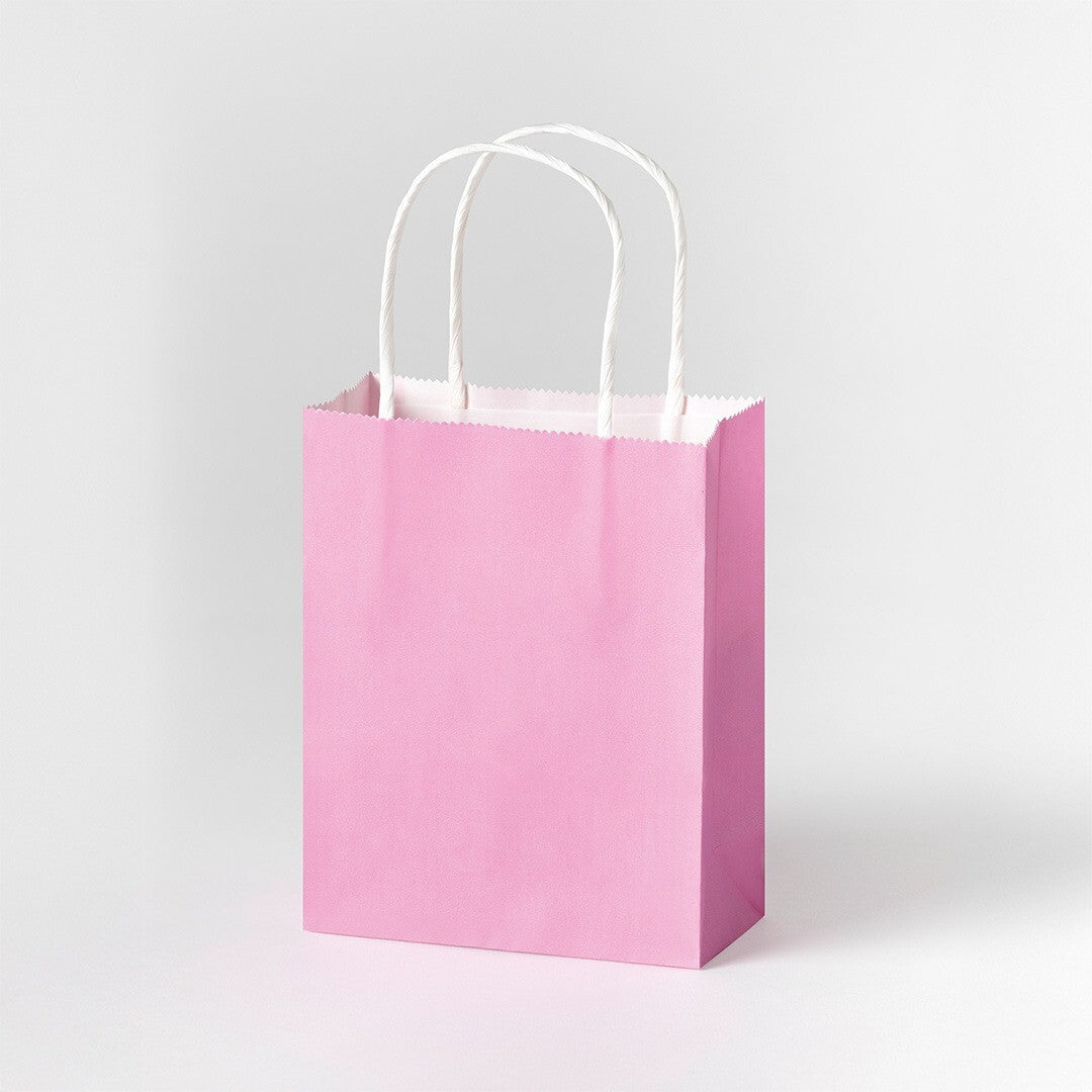 Een enkel felroze Folia pastel cadeauzakje met witte handvatten.