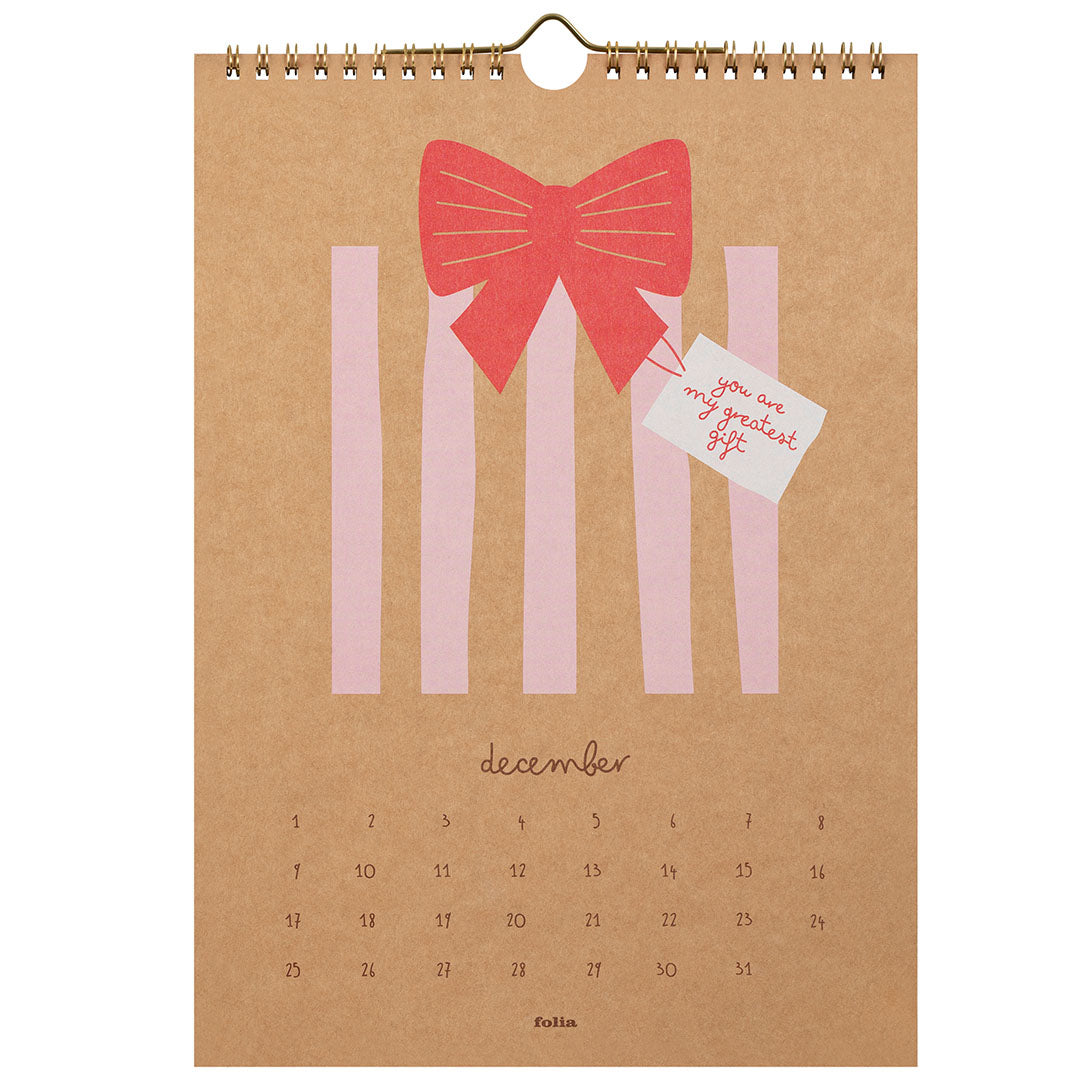 Folia wandkalenderpagina voor december met een roze cadeau met strik.