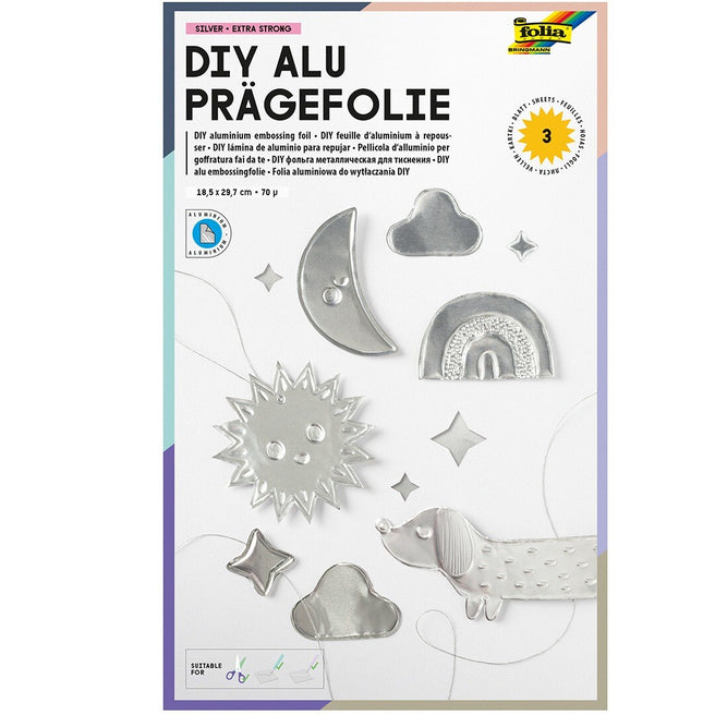 Verpakking van de Folia DIY aluminium embossingfolie met voorbeelden van zilveren, reliëf figuren zoals een zon, maan en hond.