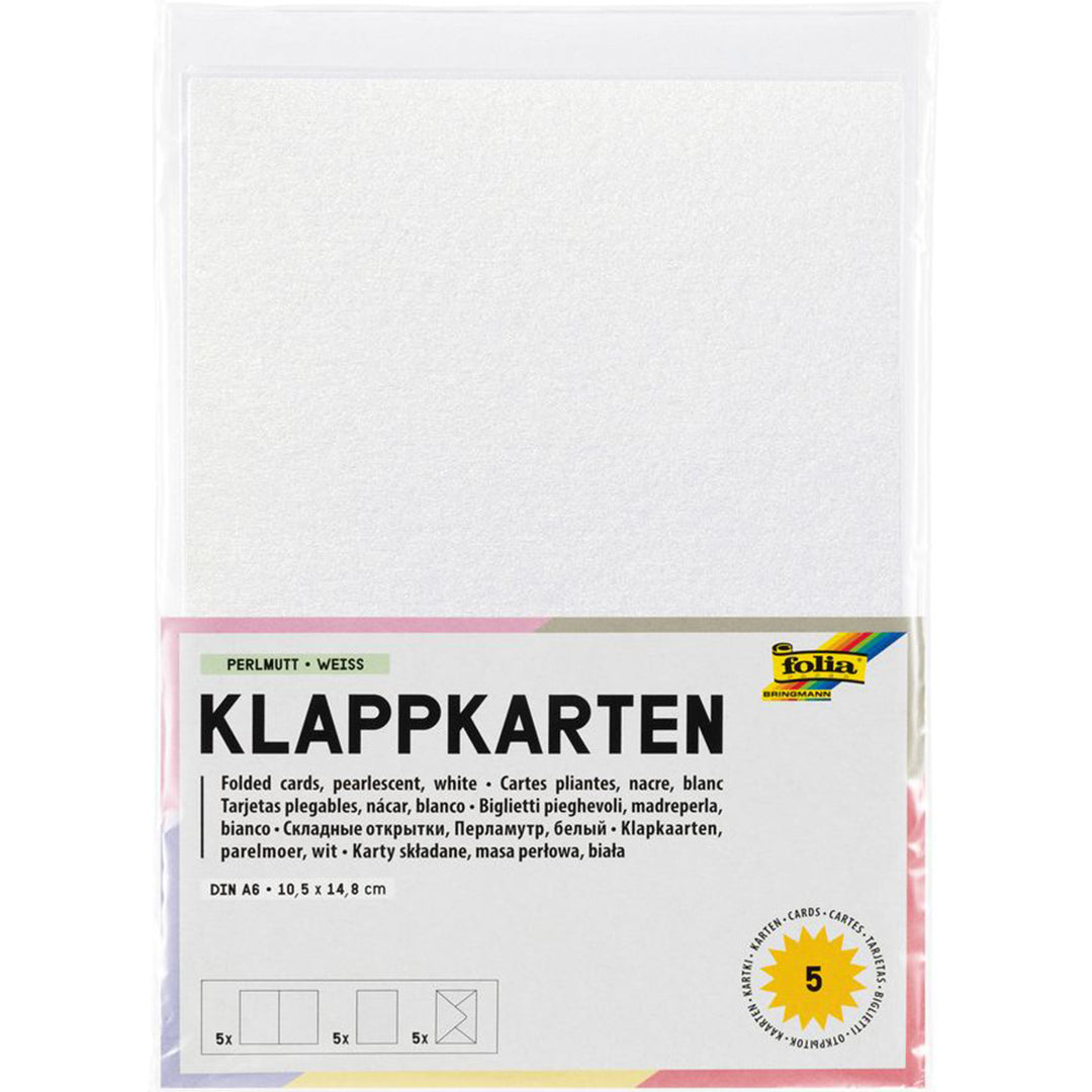 Folia verpakking van parelmoer witte klapkaarten met enveloppen.