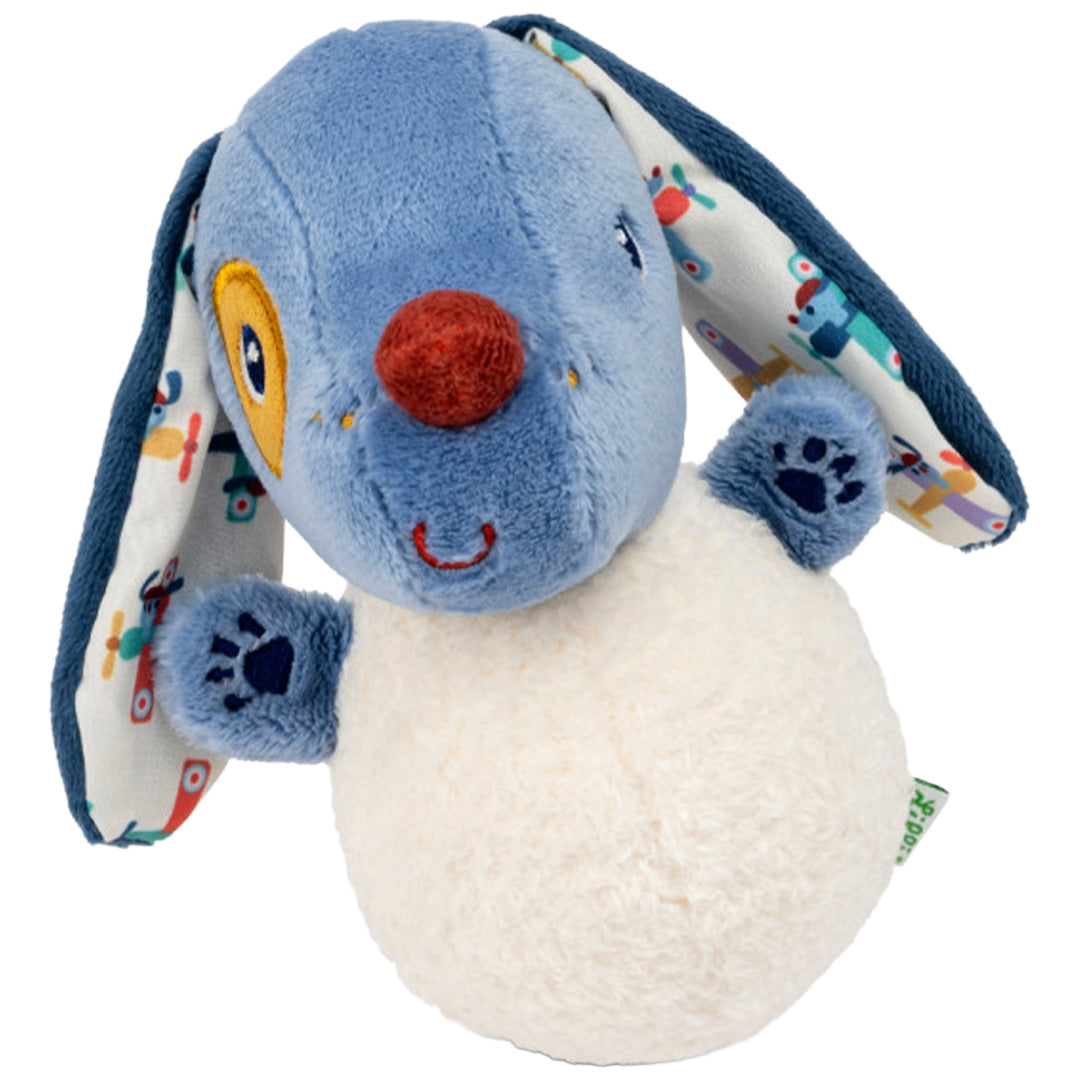 Lilliputiens muzieknuffel tuimelaar Jules de hond, een blauw-witte knuffel met patroonoren, staat schuin van voren.
