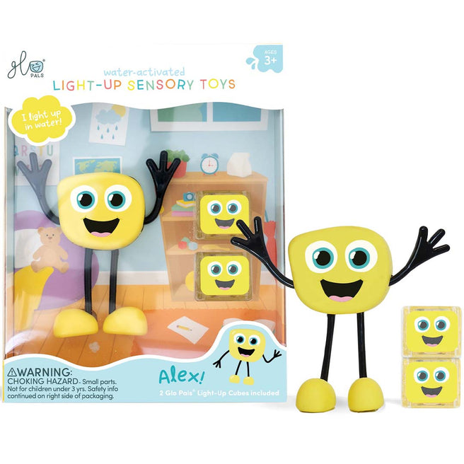 De verpakking van het glo pals lichtgevend badspeelgoed Alex, met het gele figuur en twee lichtgevende kubussen ernaast.