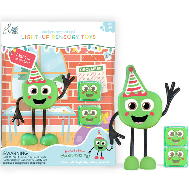 Glo Pals kerst badspeelgoed, een groen figuurtje met feestmuts en de productverpakking ernaast.
