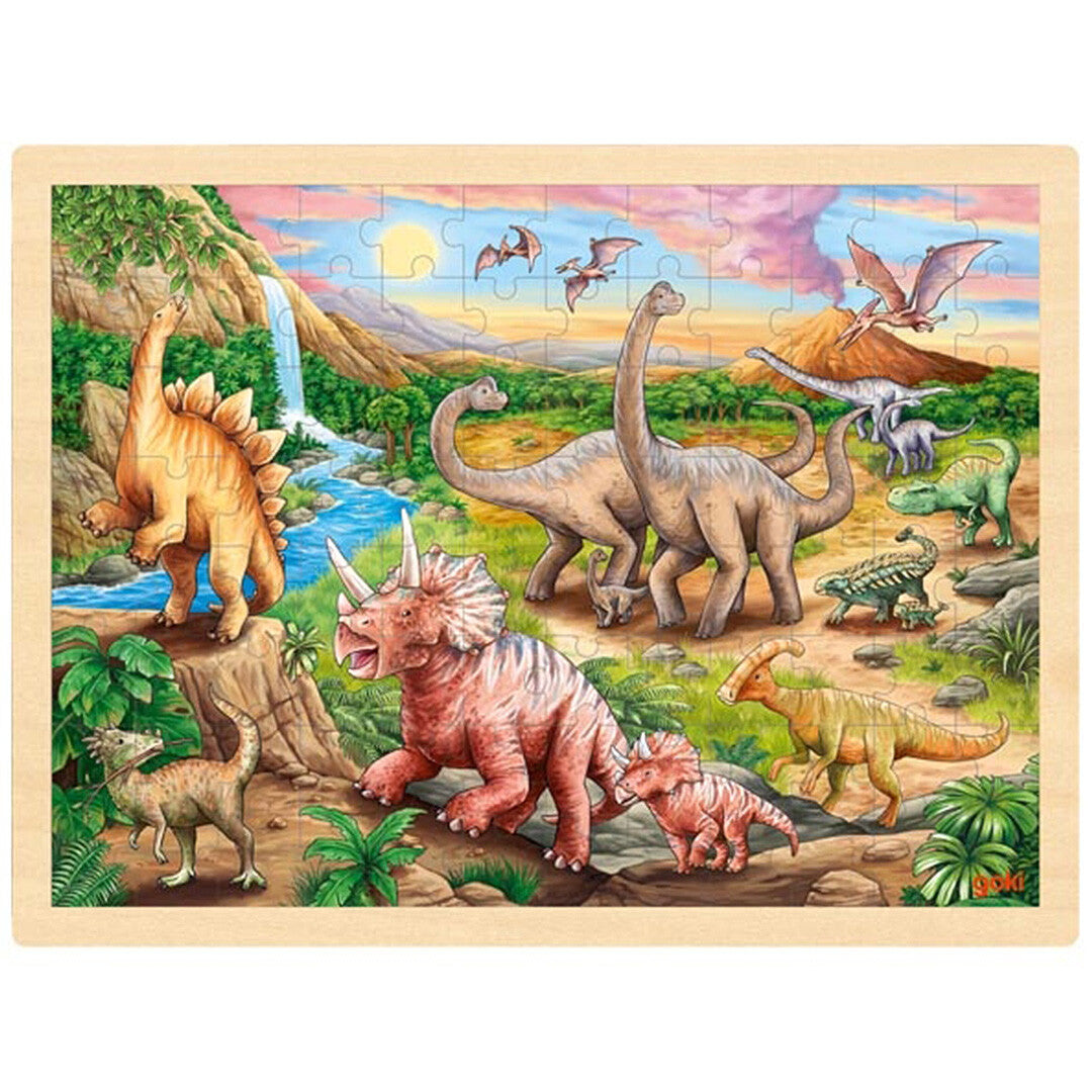 goki houten legpuzzel met een dinosauruslandschap, inclusief verschillende dinosaurussen, een waterval en een vulkaan.