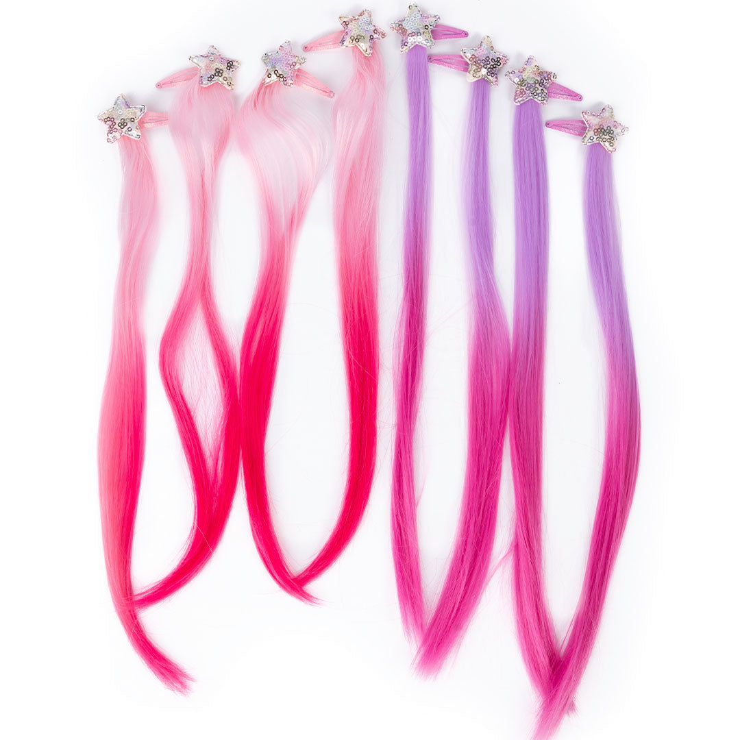 Great Pretenders veelkleurige haarextensies voor kinderen met sterrenclips, liggend op een witte ondergrond.