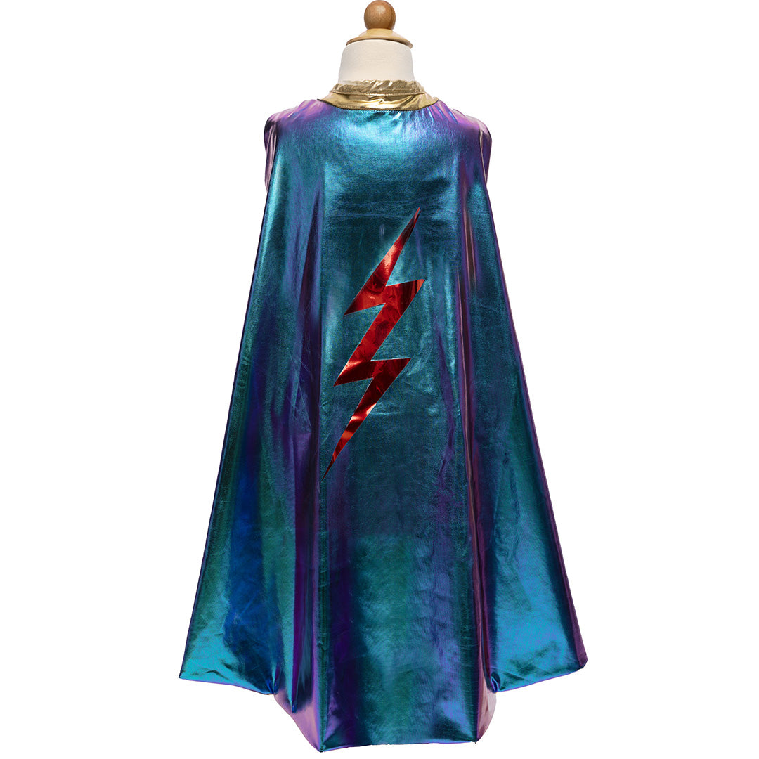 Great Pretenders omkeerbare verkleedcape voor kinderen in iriserend blauw met een rode bliksem op een paspop.