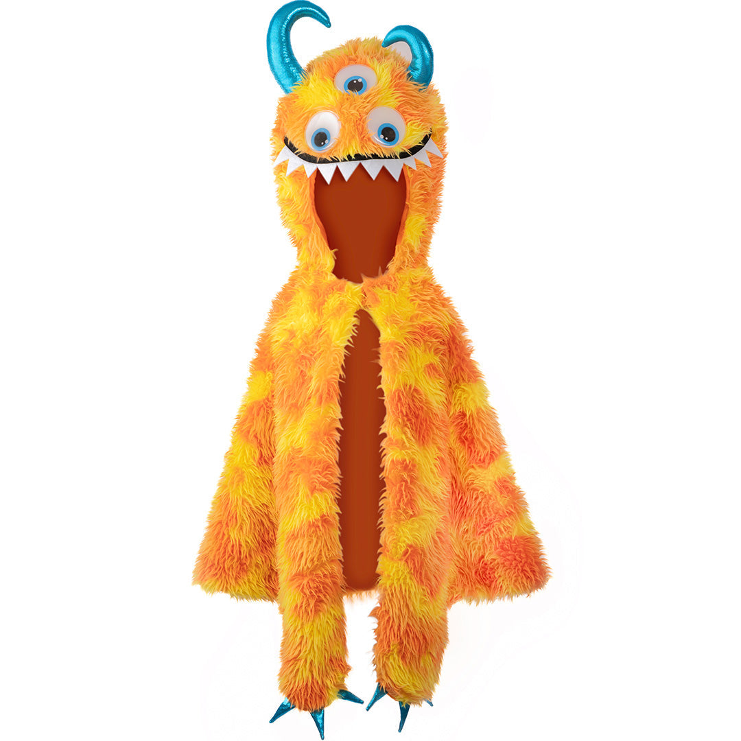 Great pretenders verkleedcape van pluche in de vorm van een oranje en gele monster met drie ogen en blauwe hoorns.