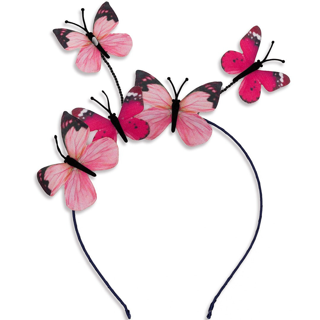 Een detailfoto van de zwarte diadeem met roze vlinders.