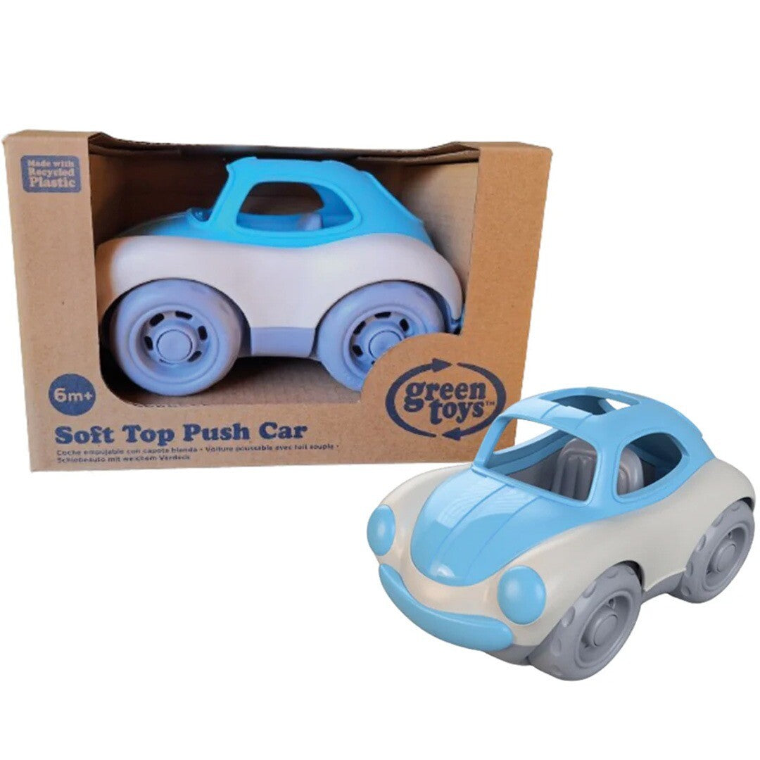 Green Toys babyspeelgoed push car met open dak, deels in de verpakking en deels ernaast.