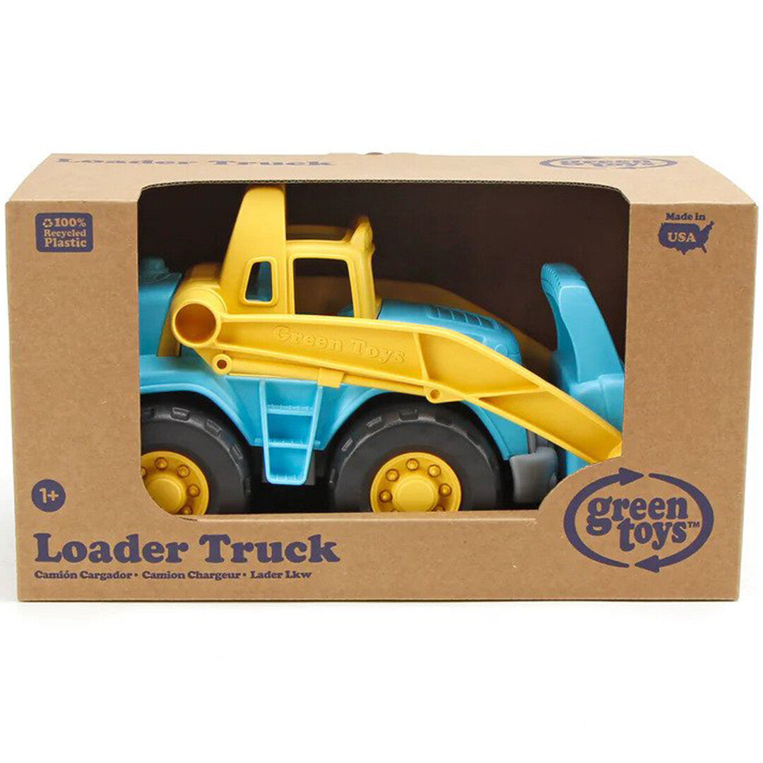 De Green Toys blauw-gele shovel in de bruine kartonnen verpakking.