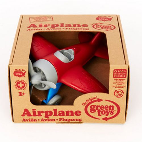 Verpakking van het Green Toys rode speelgoedvliegtuig.
