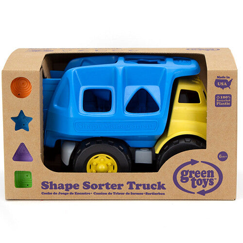 De Green Toys babyspeelgoed vuilniswagen met vormenstoof in de kartonnen verpakking.