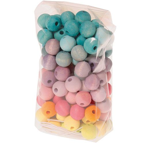 Verpakking van grimm's houten pastel kralen in een doorzichtige zak.