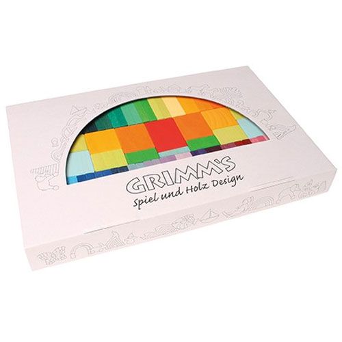Grimm's verpakking van de veelkleurige houten bouwblokken, met een ronde uitsnede die de regenboogkleuren toont.