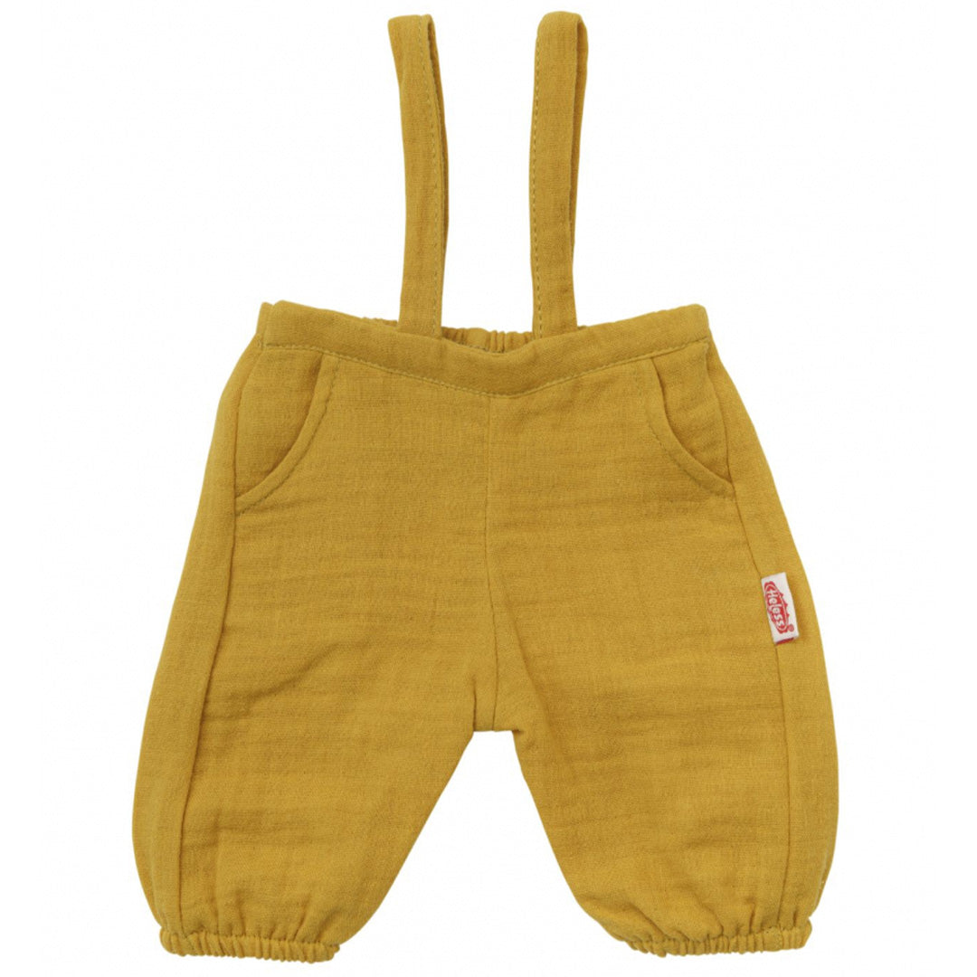 Een okergele Heless tuinbroek voor poppen, plat neergelegd.