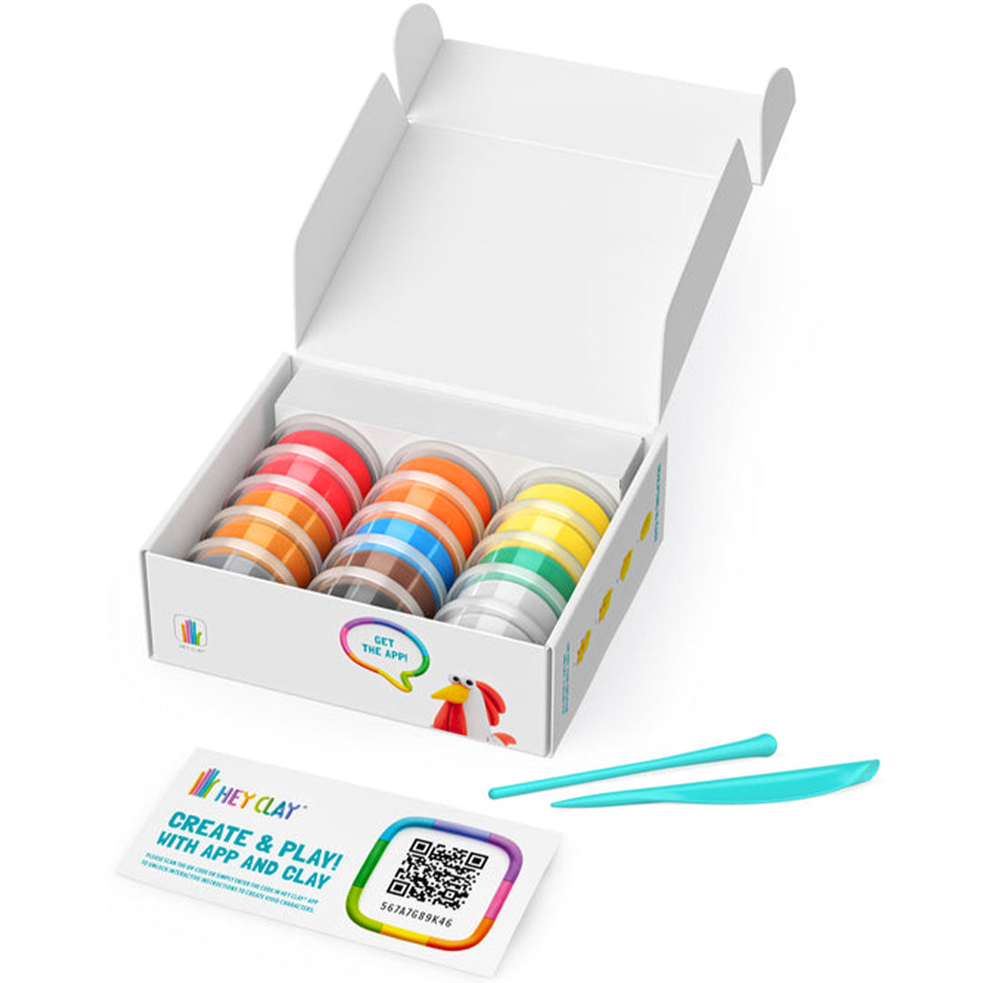 Open verpakking van de Hey Clay boetseerklei set met potjes klei en instructiekaart.