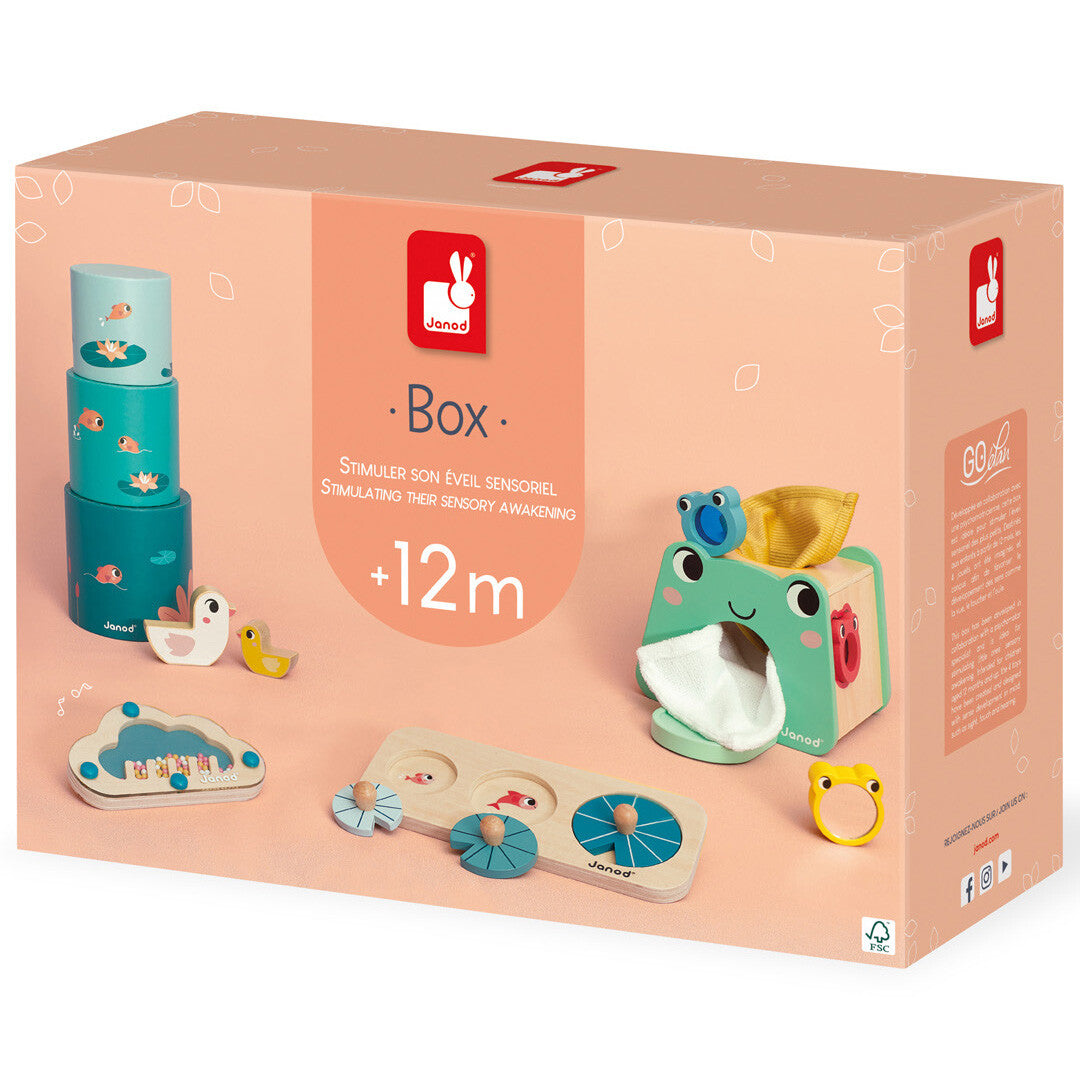 Verpakking van de Janod activiteitenbox voor baby's met de verschillende speeltjes erop afgebeeld.