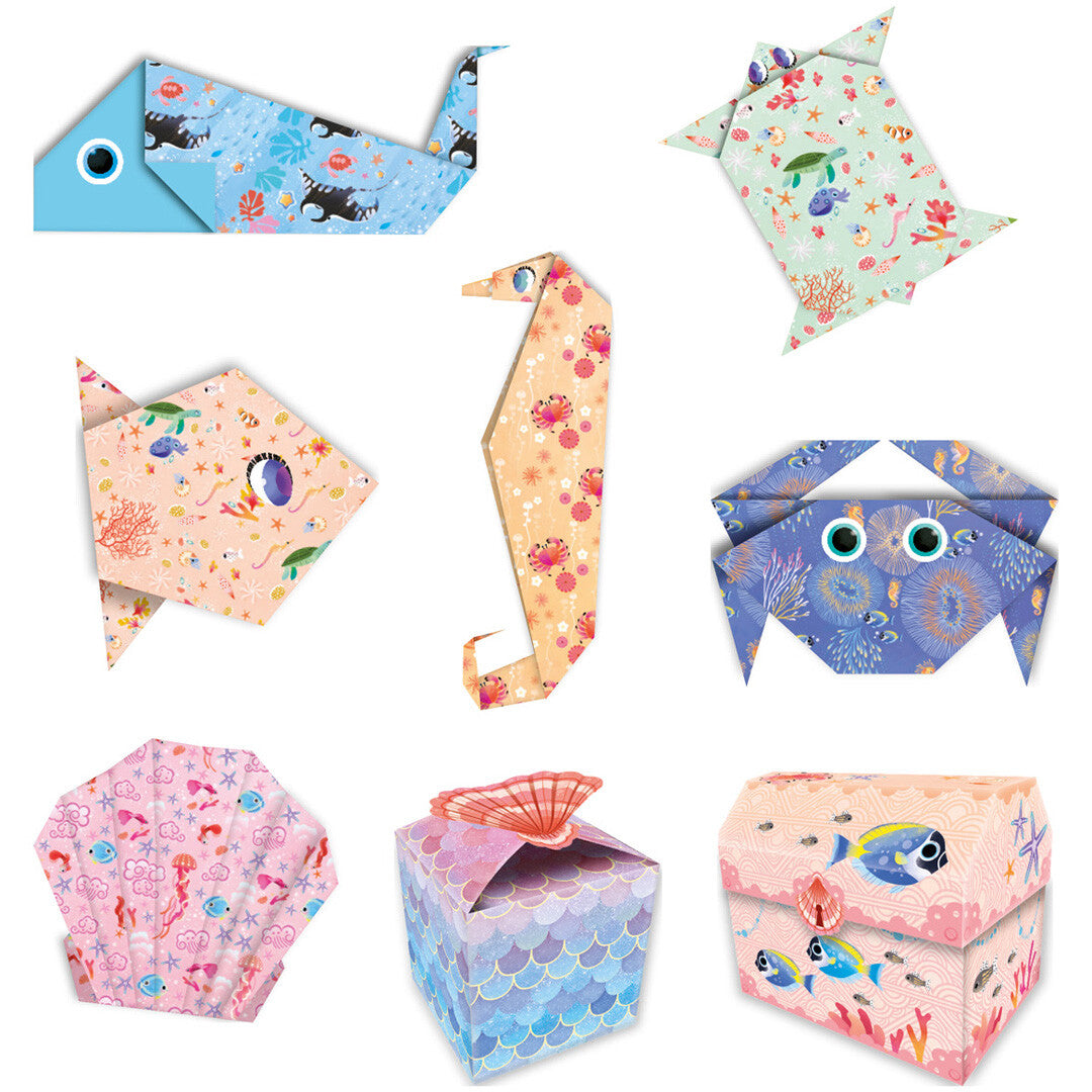 Negen individuele, gevouwen origami zeedieren en doosjes uit de Janod Magic Ocean knutselset, elk met een uniek patroon.
