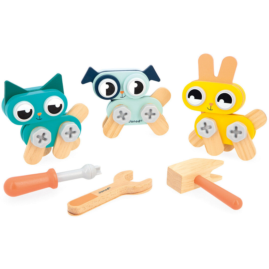 Janod bouwset met drie houten dierenfiguren (kat, hond, konijn) en gereedschap.