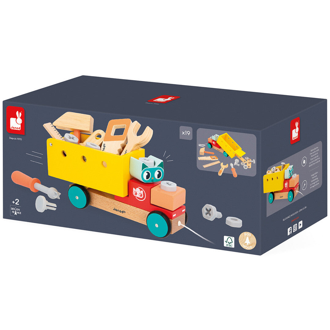 De donkerblauwe verpakking van de Janod houten bouwset trekfiguur vrachtwagen met afbeelding van het speelgoed.