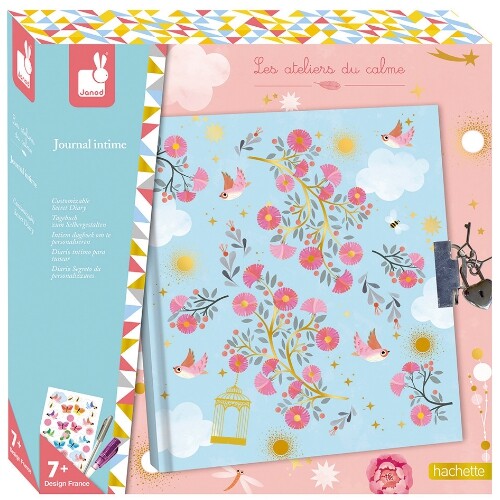 Janod dagboek set in verpakking, met een blauw dagboek versierd met bloemen en vogels.