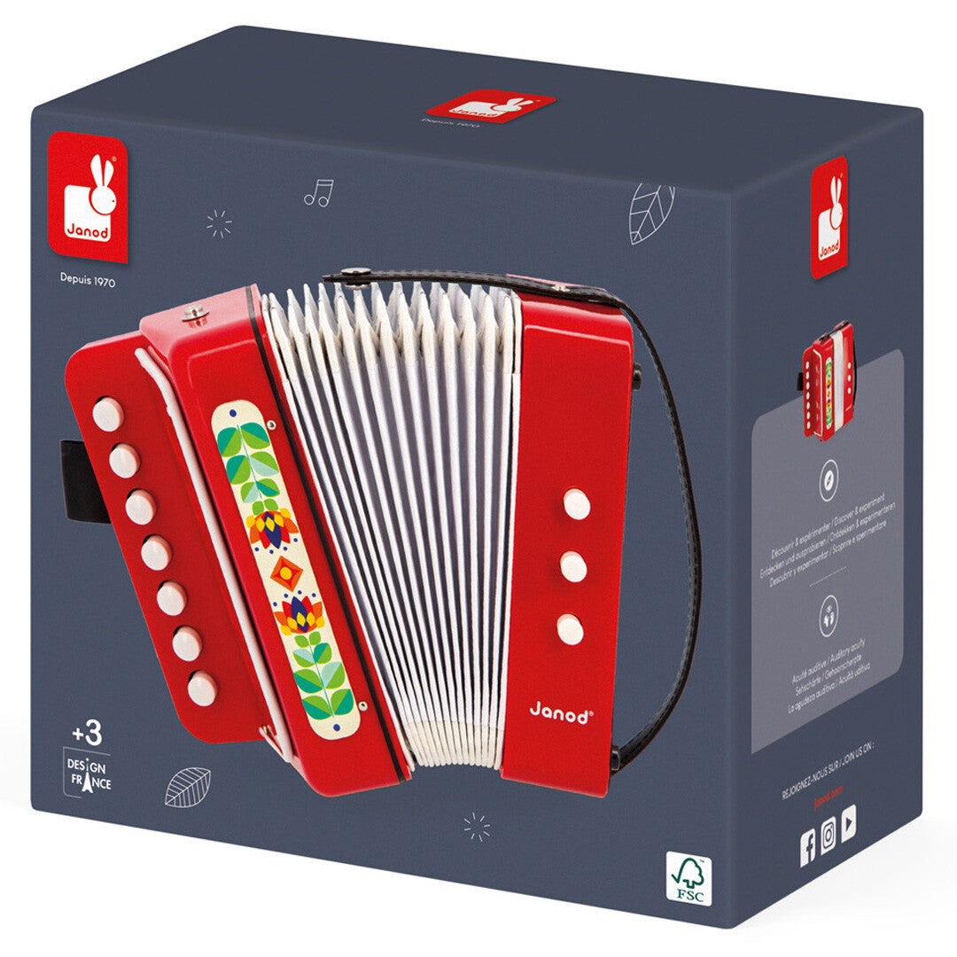 De donkergrijze verpakking van de Janod speelgoedaccordeon.