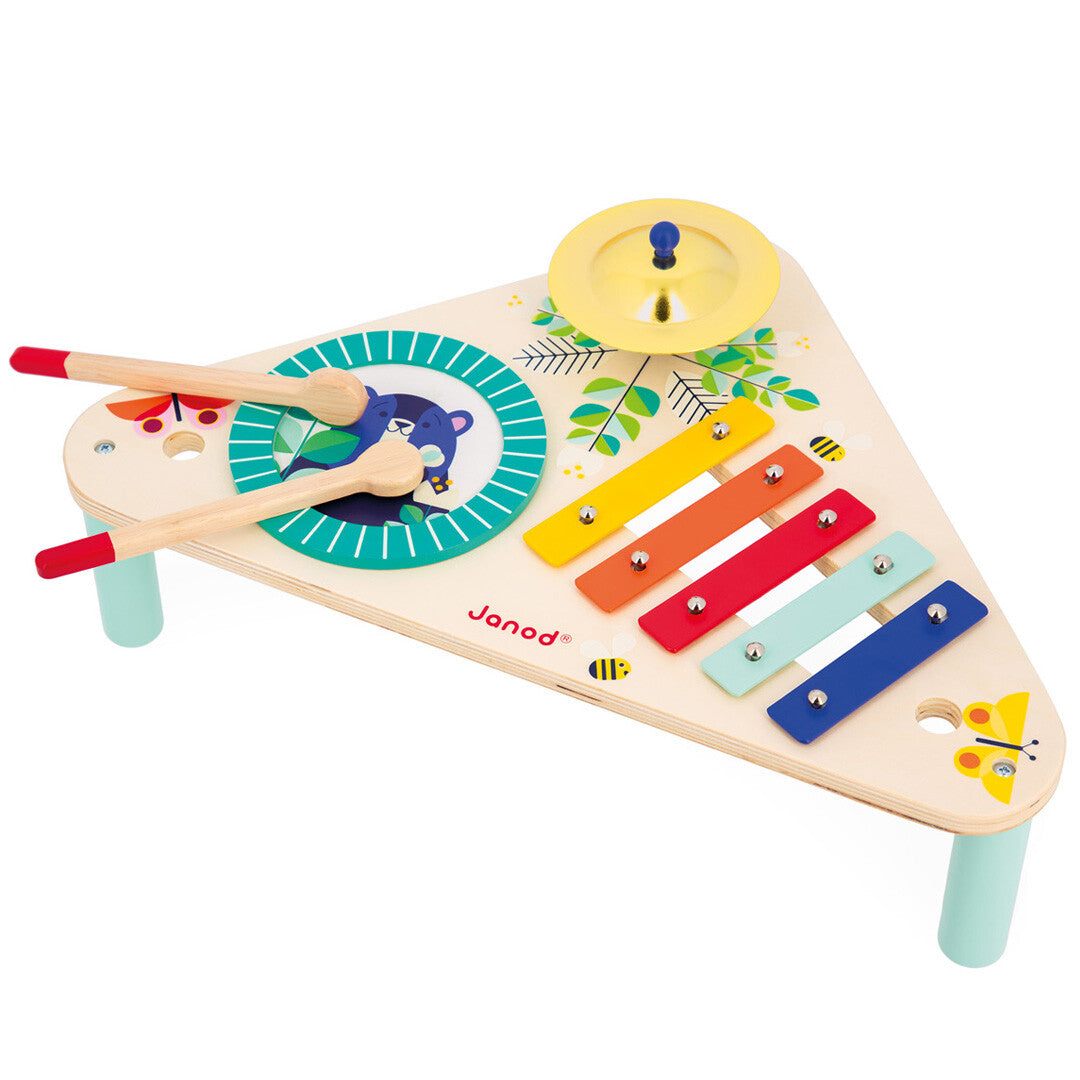 Janod Gioia houten muziektafel met xylofoon, trommel, cimbaal en drumstokjes, versierd met dieren en bladeren.