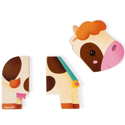 Losse onderdelen van de Janod magnetische houten koe, met de kop en twee lichaamsdelen.