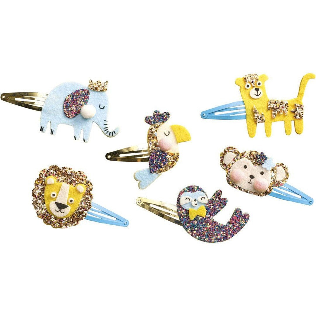 Zes Janod glitter haarclipjes in de vorm van exotische dieren zoals een olifant, leeuw en aap.
