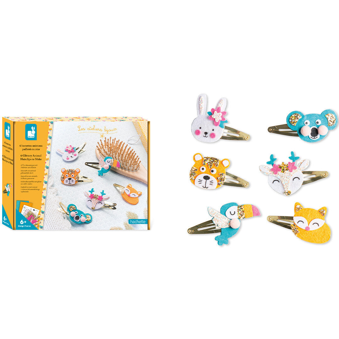 De Janod knutselset verpakking naast de zes gemaakte glitter dieren haarclips.