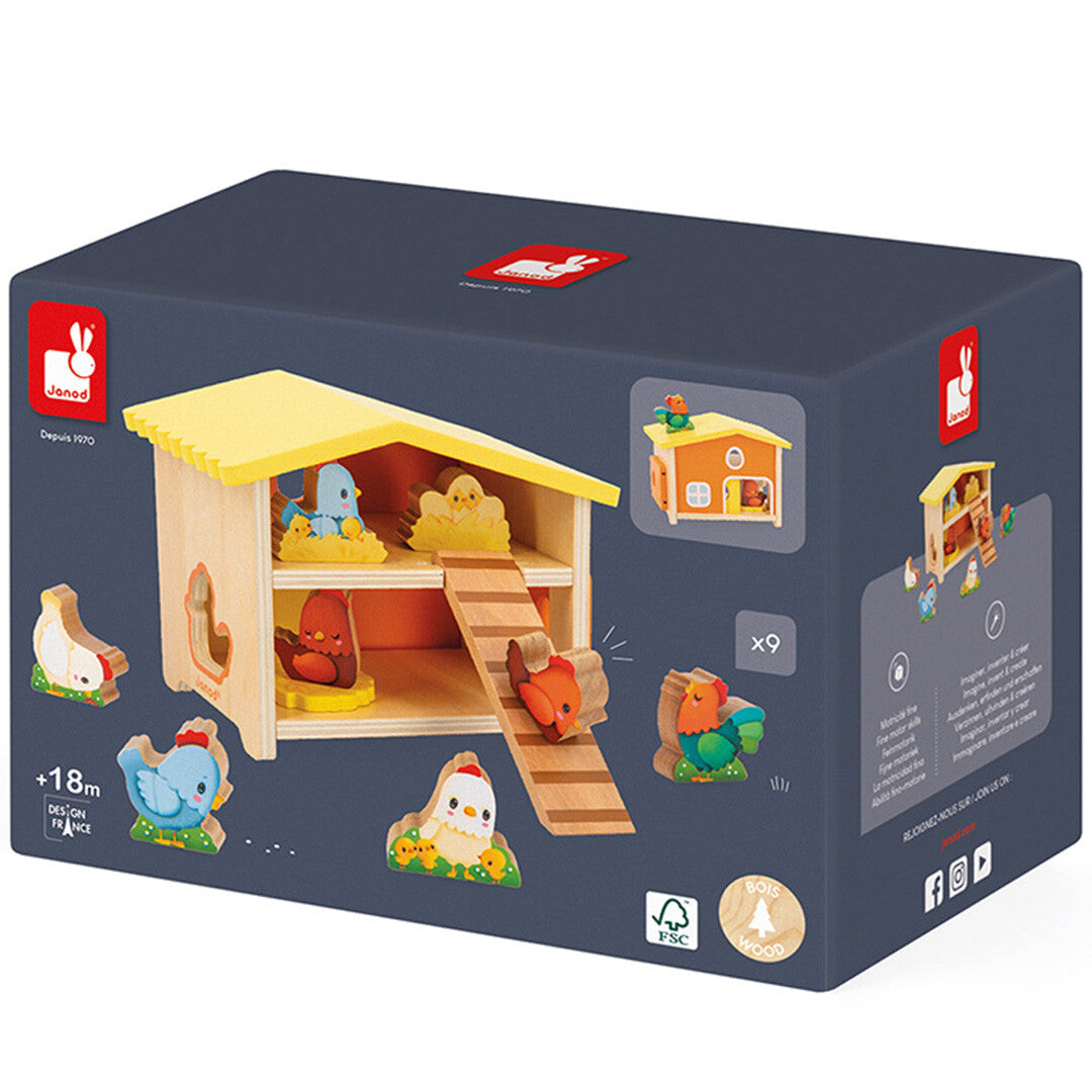Verpakking van de Janod houten kippenhok speelset met een afbeelding van het speelgoed.
