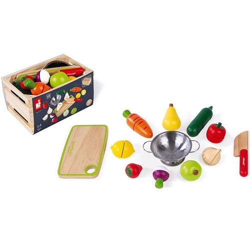 De Janod houten snijgroenten en fruit speelgoedset met verpakking en losse onderdelen, van bovenaf gezien.
