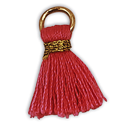 Een detailfoto van een roze kwastje met een gouden ring.