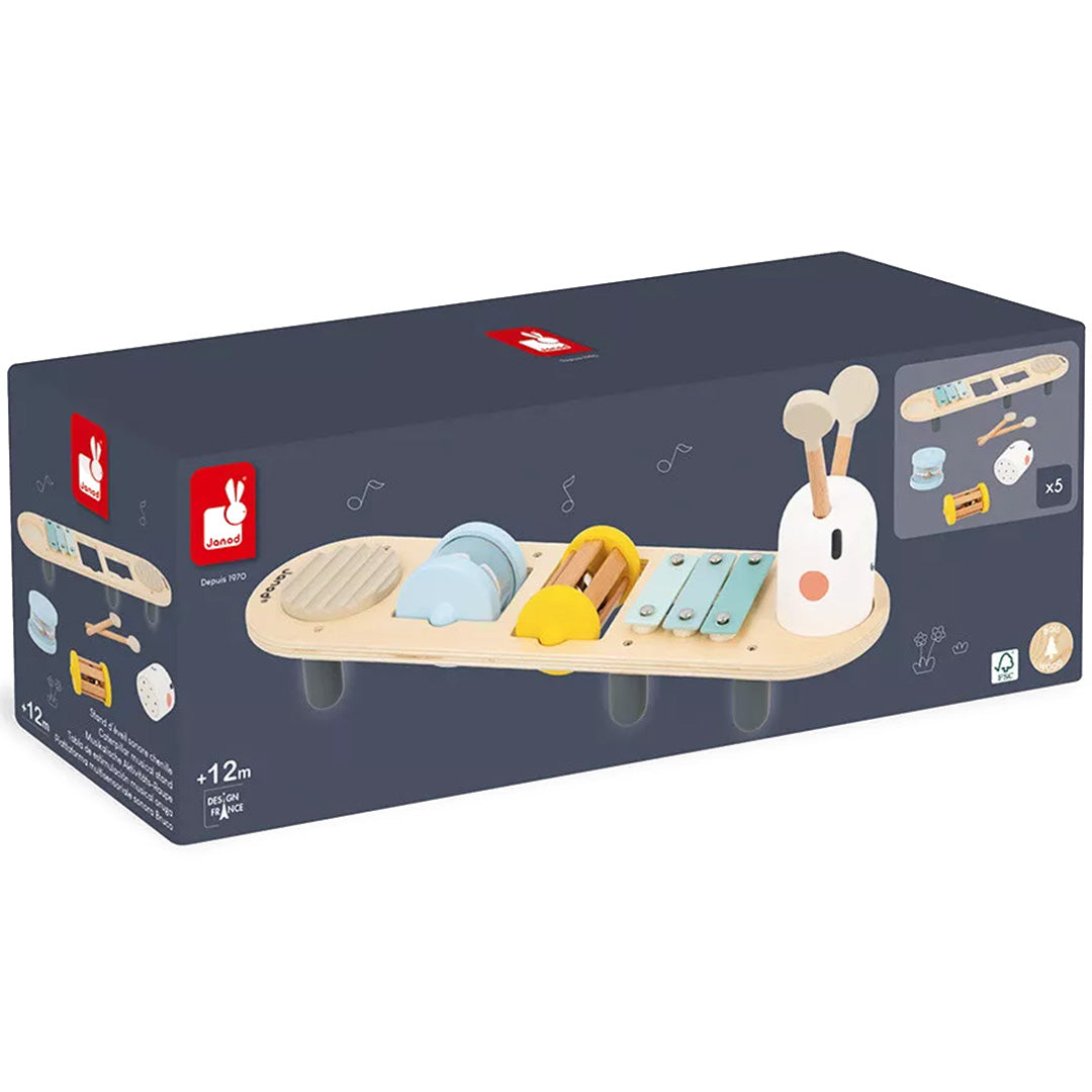 De verpakking van de Janod houten muziektafel in de vorm van een rups.